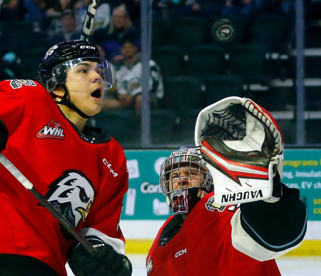 Portland Winterhawks winger Aidan Litke and goaltender Jan Spunar watch the puck sail over the crease against the Everett Silvertips during Game 3 of a first-round WHL playoff series on Monday at Angel of the Winds Arena in Everett. (Ryan Berry / The Herald)