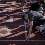 Lake Stevens sprinters line up during a track and field practice March 22 at Lake Stevens High School. (Annie Barker / The Herald)