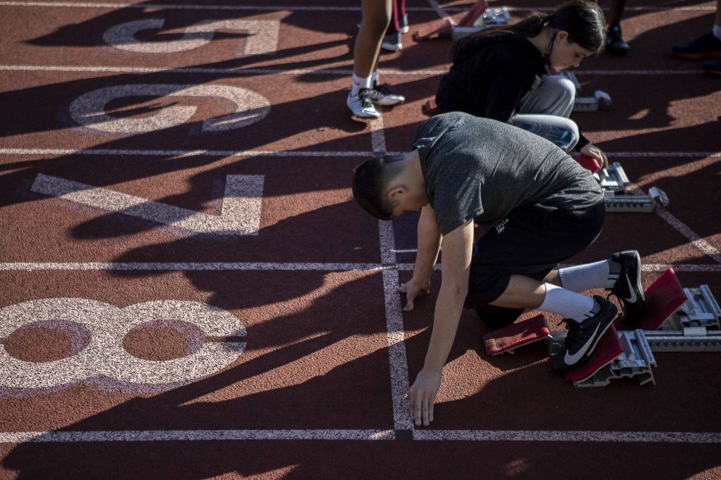 Lake Stevens sprinters line up during a track and field practice March 22 at Lake Stevens High School. (Annie Barker / The Herald)