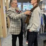 Spiffy Thrifty Fashion coach Tim Lambright, left, adjusts a scarf on Von Sandeno, 15, during a thrifting session on April 1, 2023. (Submitted photo)