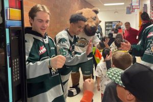 Everett Silvertips' Beau Courtney (left) was named U.S. Division Humanitarian of the Year and a finalist for the WHL's Doug Wickenheiser Memorial Trophy as the WHL's Humanitarian of the Year. (Photo courtesy of Everett Silvertips)