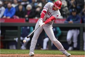 Los Angeles Angels' Shohei Ohtani hits an RBI single to score Taylor Ward during the seventh inning of a baseball game against the Seattle Mariners, Wednesday, April 5, 2023, in Seattle. (AP Photo/Lindsey Wasson)