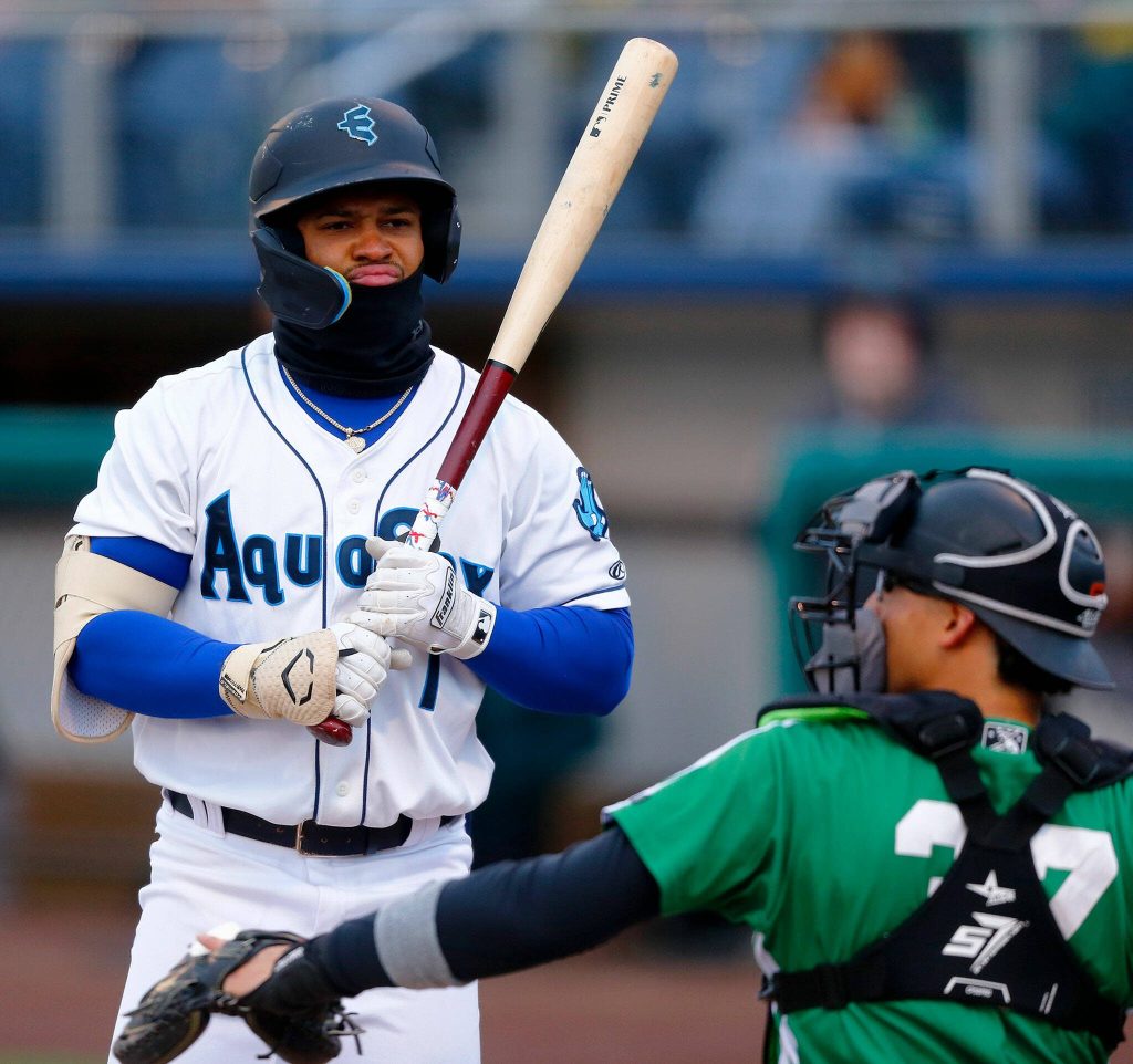AquaSox outfielder Jonatan Clase makes a face at a pitch he didnt like during the season opener against the Eugene Emeralds on Friday, April 7, 2023, at Funko Field in Everett, Washington. (Ryan Berry / The Herald)