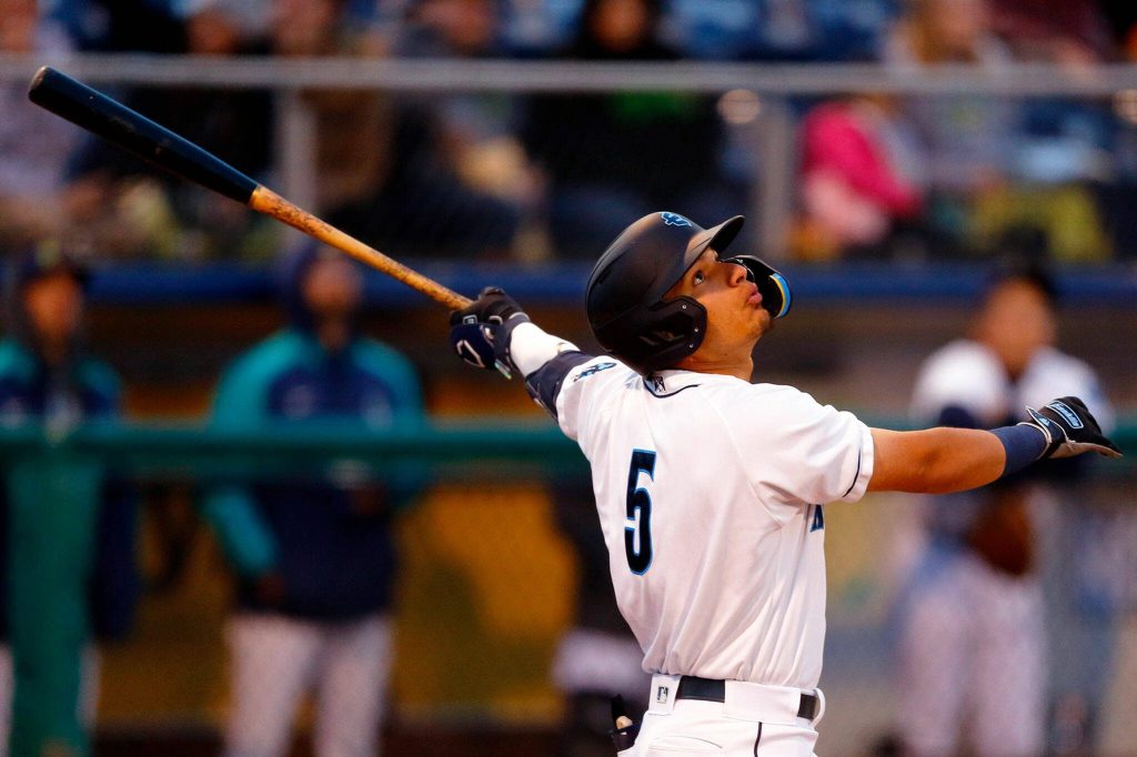 AquaSox shortstop Axel Sanchez pops up a ball during the season opener against the Eugene Emeralds on Friday, April 7, 2023, at Funko Field in Everett, Washington. (Ryan Berry / The Herald)