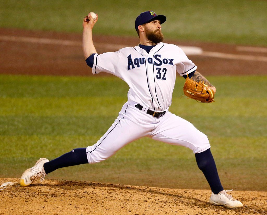 AquaSox reliever Ty Adcock delivers a pitch during the season opener against the Eugene Emeralds on Friday, April 7, 2023, at Funko Field in Everett, Washington. (Ryan Berry / The Herald)