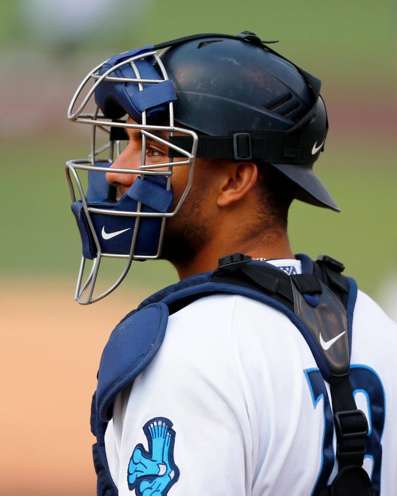 AquaSox catcher Harry Ford gets settled behind the plate before the first inning of the season opener against the Eugene Emeralds on Friday, April 7, 2023, at Funko Field in Everett, Washington. (Ryan Berry / The Herald)