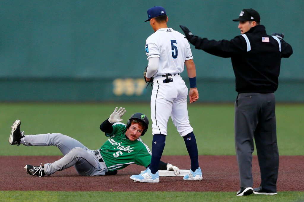 Eugene outfielder Wade Meckler calls for time after sliding in safe at second base during the Aquasox season opener on Friday, April 7, 2023, at Funko Field in Everett, Washington. (Ryan Berry / The Herald)