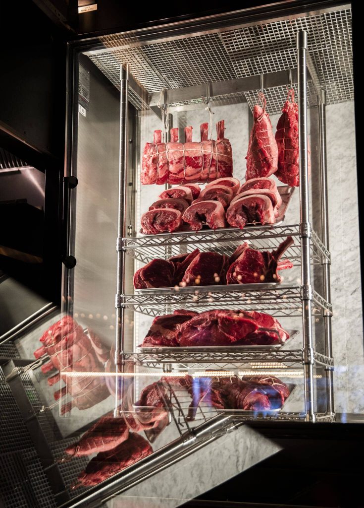 Cuts of meat are visible as they dry at Fogo de Chão on Thursday, April 20, 2023 in Lynnwood, Washington. (Olivia Vanni / The Herald)