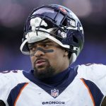 Denver Broncos defensive end Dre'Mont Jones stands on the sideline in the second half of an NFL football game against the Baltimore Ravens, Sunday, Dec. 4, 2022, in Baltimore. (AP Photo/Patrick Semansky)