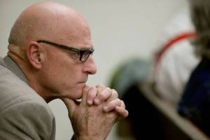 Mark Mulligan / The Herald
Sitting in the gallery, Snohomish County Prosecuting Attorney Mark Roe listens to opening statements in Snohomish County Superior Court in Everett Thursday morning. Prosecutors allege that the off-duty Marysville police officer Derek Carlisle failed to heed or be aware of the danger of leaving his four children alone in a van with a loaded handgun. Investigators believe Carlisle's three-year-old son grabbed a loaded .38-caliber-revolver from the cup holder area in the front of the van and accidentally fired a single shot that killed Carlisle's seven-year-old daughter.
Photo taken 20121108