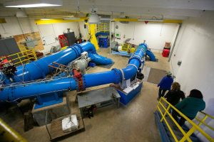 The inside of the powerhouse at the Woods Creek Hydroelectric Project is seen from the top stairwell on Thursday, April 13, 2023, in Monroe, Washington. The blaring sound of machinery makes it hard to communicate inside the space. (Ryan Berry / The Herald)