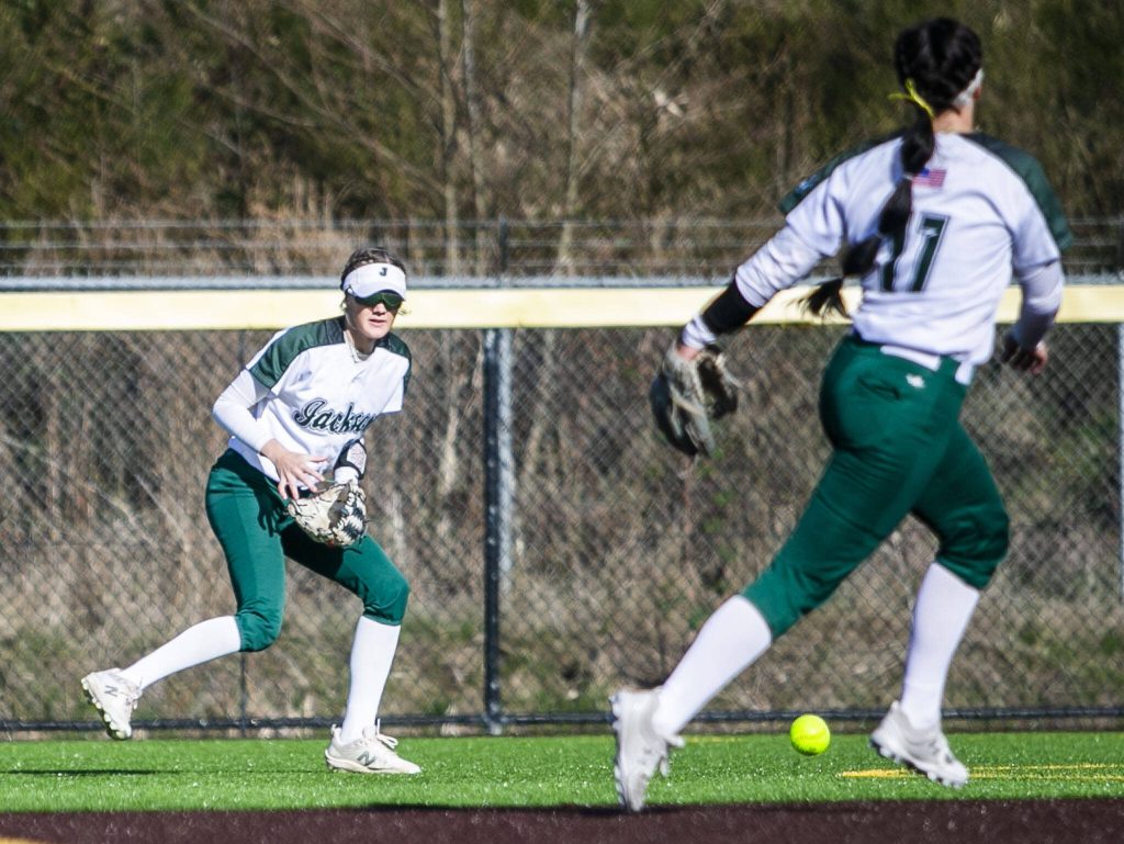 Jackson players shift to field the ball during the game against Kamiak on Tuesday, April 11, 2023 in Everett, Washington. (Olivia Vanni / The Herald)