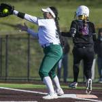 Simone Williams catches the ball to get an out at first during the game against Kamiak on Tuesday, April 11, 2023 in Everett, Washington. (Olivia Vanni / The Herald)