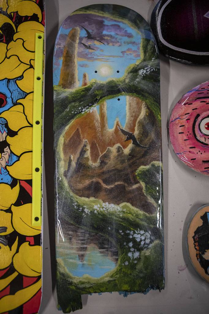 A skateboard by artist Tyler Porter at Graphite Arts Center in Edmonds, Washington on Saturday, April 15, 2023. A silent auction of skateboard art will be held to raise money to kick-start Riveras new nonprofit, Salvage Arts. (Annie Barker / The Herald)