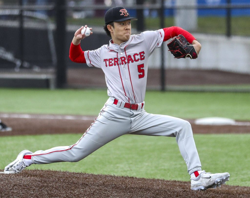 Mountlake Terraces Tyler Song (5) pitches during a baseball game between Edmonds-Woodway and Mountlake Terrace at Edmonds-Woodway High School in Edmonds, Washington on Thursday, April 13, 2023. The Warriors won, 5-1. (Annie Barker / The Herald)
