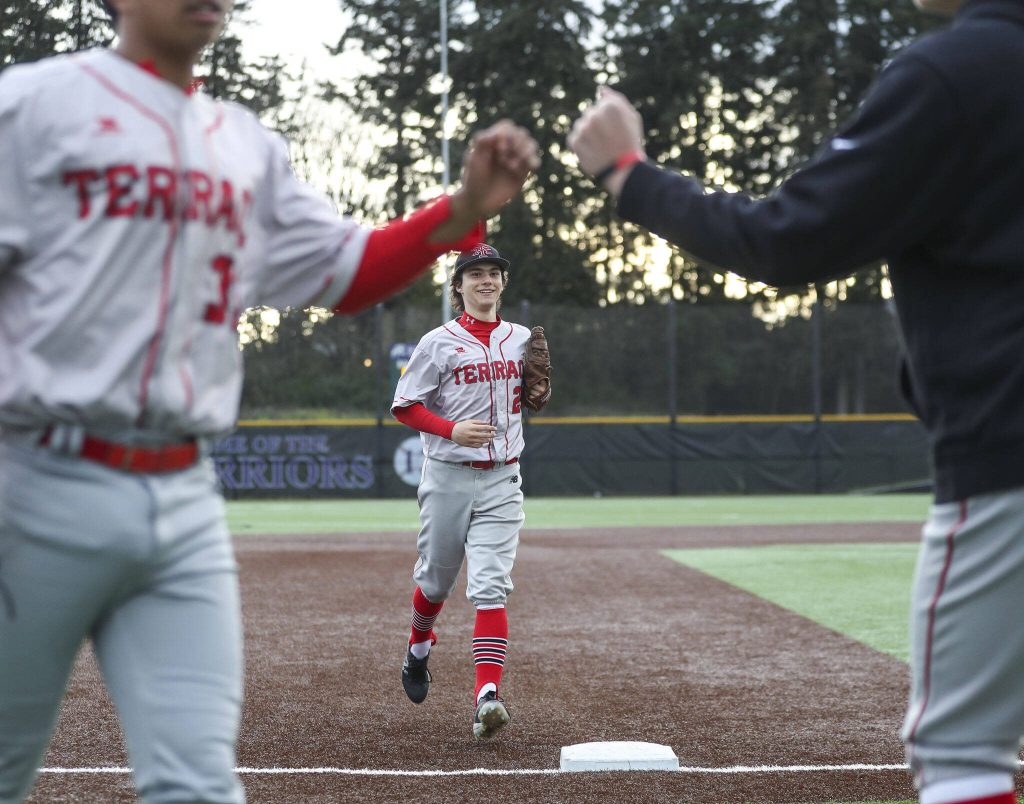 Edmonds-Woodways Diego Escandon (2) slides into second during a baseball game between Edmonds-Woodway and Mountlake Terrace at Edmonds-Woodway High School in Edmonds, Washington on Thursday, April 13, 2023. The Warriors won, 5-1. (Annie Barker / The Herald)