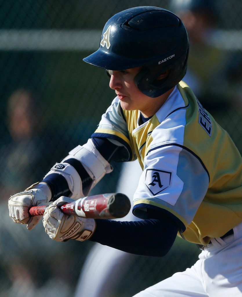 Arlingtons Camden Knudsen lays down a bunt while trying to manufacture some offense during a game against Snohomish on Friday, April 14, 2023, at Earl Torgeson Field in Snohomish, Washington. (Ryan Berry / The Herald)