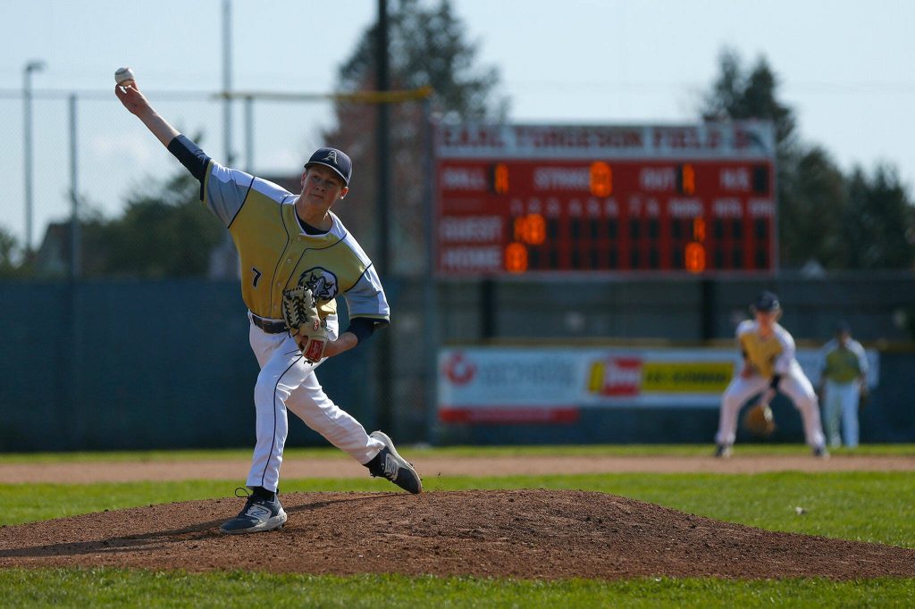 Arlington starting pitcher Ty Rusko delivers a pitch during a matchup against Snohomish on Friday, April 14, 2023, at Earl Torgeson Field in Snohomish, Washington. (Ryan Berry / The Herald)