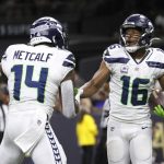 Seattle Seahawks wide receiver Tyler Lockett (16) celebrates his touchdown with wide receiver DK Metcalf during an NFL football game against the Seattle Seahawks in New Orleans, Sunday, Oct. 9, 2022. (AP Photo/Derick Hingle)