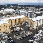 Builders work on the Four Corners Apartments on Beverly Lane near Evergreen Way and 79th Place SE on March 1, in Everett. (Olivia Vanni / The Herald file photo)