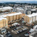 Builders work on the Four Corners Apartments on Beverly Lane near Evergreen and 79th Place SE on Wednesday, March 1, 2023 in Everett, Washington. DevCo, the real estate company building the affordable housing, is receiving a $1 million grant from the city of Everett. (Olivia Vanni / The Herald)