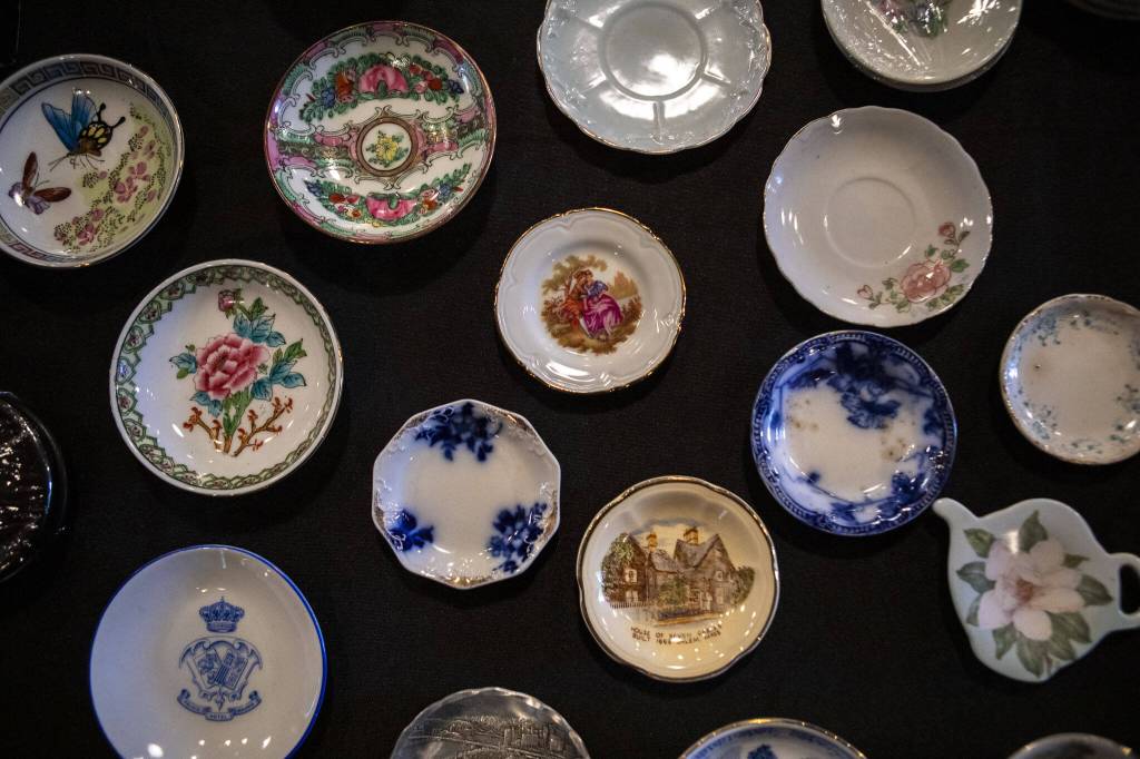 Tea saucers are displayed for sale during the Cascadia Tea spring festival at Floral Hall in Everett, Washington on Saturday, April 15, 2023. (Annie Barker / The Herald)