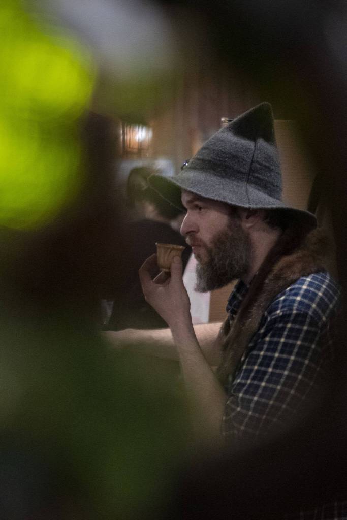 Omar Riverstone sips on tea during the Cascadia Tea spring festival at Floral Hall in Everett, Washington on Saturday, April 15, 2023. (Annie Barker / The Herald)