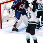 The Krakens Oliver Bjorkstrand (22) celebrates a goal by Eeli Tolvanen (20) as Avalanche goaltender Alexandar George looks on during the first period of Game 1 of a first-round playoff series Tuesday in Denver. (AP Photo/Jack Dempsey)