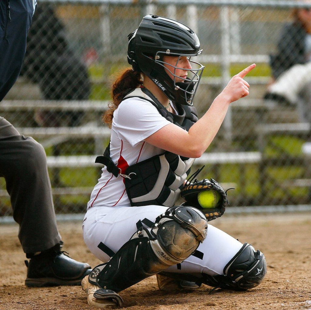 Mountlake Terrace catcher Cameron Dunn points to her pitcher after receiving a pitch during a game against Archbishop Murphy on Tuesday, April 18, 2023, at her team’s home field in Mountlake Terrace, Washington. (Ryan Berry / The Herald)