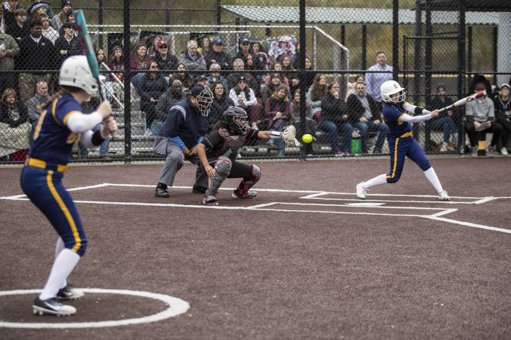 Everetts Charlie Oyler (14) swings during an Everett and Cascade softball game at Phil Johnson Ballfields in Everett, Washington on Friday, April 21, 2023. Cascade won, 12-2. (Annie Barker / The Herald)