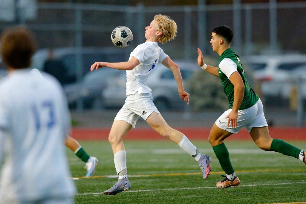 Shorewoods Finn Delachapelle controls the ball with his chest against Edmonds-Woodway on Friday, April 21, 2023, at Edmonds Stadium in Edmonds, Washington. (Ryan Berry / The Herald)