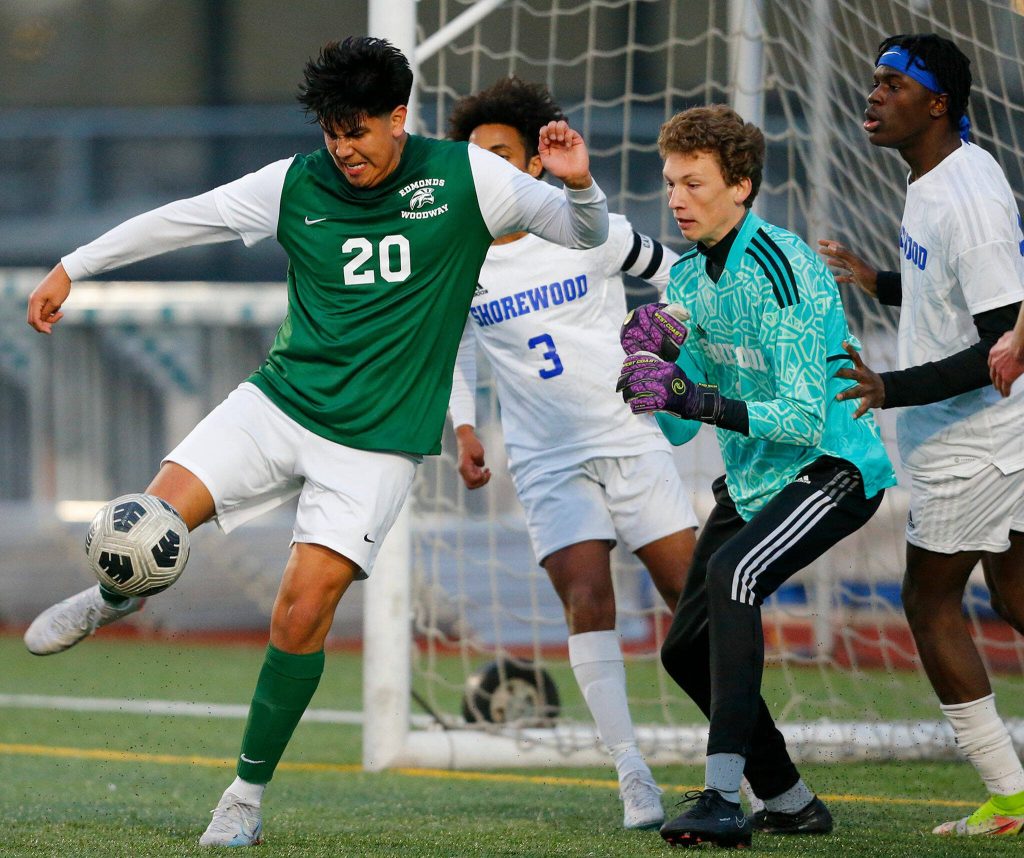 Edmonds-Woodways Antony Cesar unsuccessfully tries to turn and sneak the ball into the net during a scramble in front of the goal against Shorewood on Friday, April 21, 2023, at Edmonds Stadium in Edmonds, Washington. (Ryan Berry / The Herald)