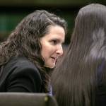 Martha Saracino turns to speak with fellow members of the prosecution during the first day of the trial of Shayne Baker on Monday, April 24, 2023, at Snohomish County Superior Court in Everett, Washington. (Ryan Berry / The Herald)
