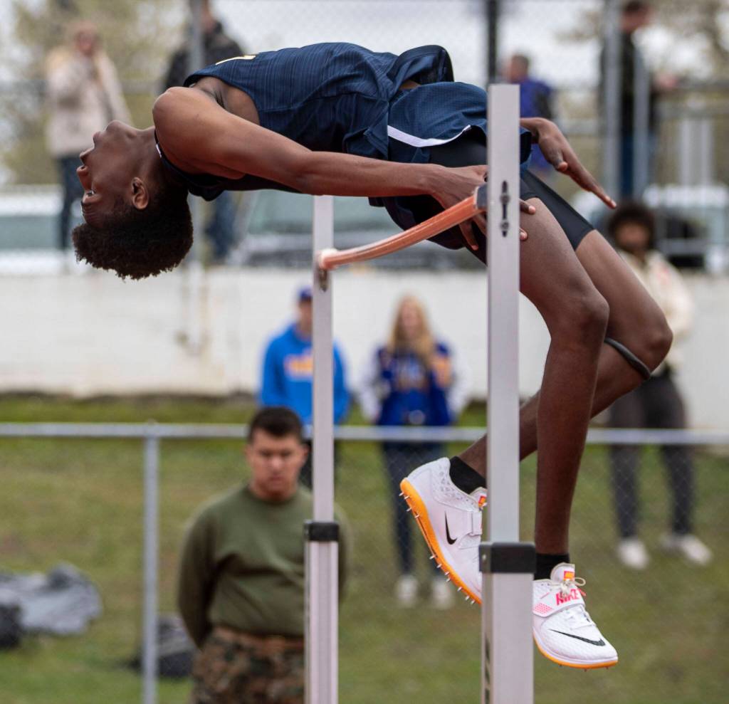 Everetts Shukurani Ndayiraglje performs the high jump during the Eason Invitational at Veterans Memorial Stadium in Snohomish, Washington on Saturday, April 22, 2023. (Annie Barker / The Herald)
