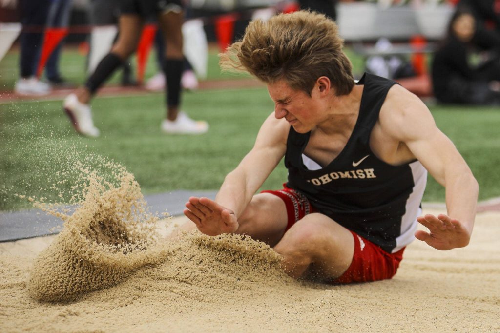 A Snohomish athlete performs the triple jump during the Eason Invitational at Veterans Memorial Stadium in Snohomish, Washington on Saturday, April 22, 2023. (Annie Barker / The Herald)