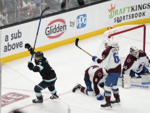 Kraken right wing Jordan Eberle (7) celebrates scoring to win the game as Avalanche defenseman Cale Makar (8), left wing Artturi Lehkonen (62) and goaltender Alexandar Georgiev (40) react during overtime of Game 4 of first-round playoff series Monday in Seattle. (AP Photo/Lindsey Wasson)