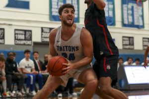 ECC’s Elyon Zevenbergen (34) shoots the ball during a men’s game between the Everett Community College Trojans and Edmonds College Tritons at Seaview Gymnasium at Edmonds College in Lynnwood, Washington on Wednesday Jan. 25, 2023. The Tritons won, 91-84. (Annie Barker / The Herald)