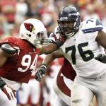 Seahawks tackle Russell Okung (76) blocks the Cardinals Sam Acho during a game in 2012 in Glendale, Ariz. (AP Photo/Ross D. Franklin)