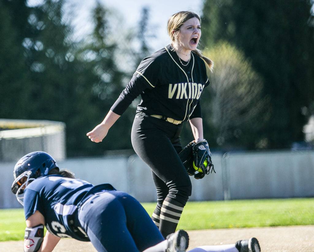 Lake Stevens Alexis Johnson yells after getting an out at third during the game against Glacier Peak on Tuesday, April 25, 2023 in Lake Stevens, Washington. (Olivia Vanni / The Herald)