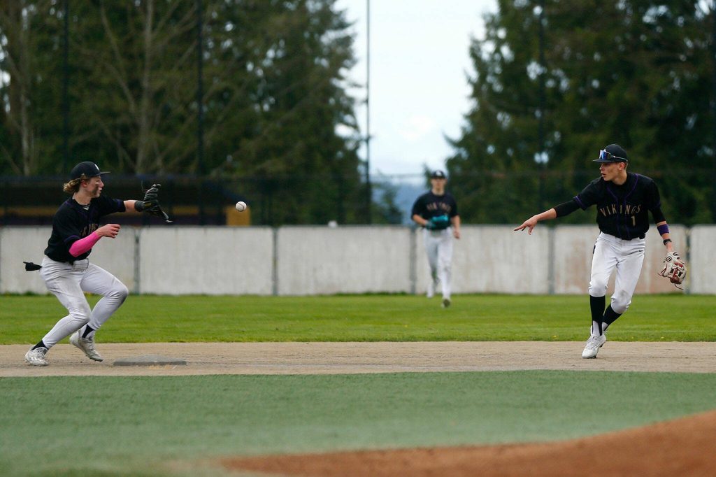 Lake Stevens turns a crucial double play late in a win over Jackson on Wednesday, April 26, 2023, in Lake Stevens, Washington. (Ryan Berry / The Herald)