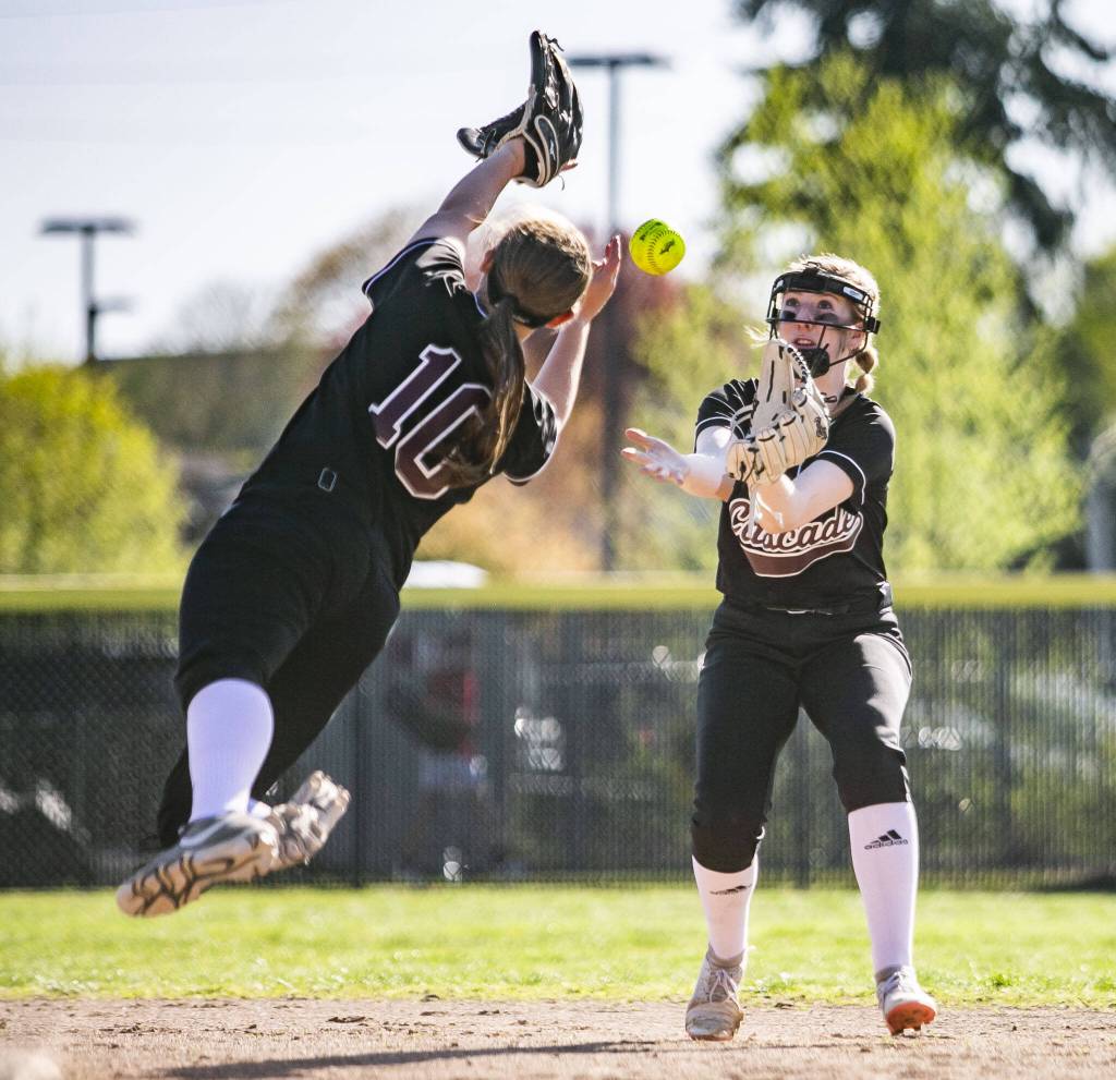 Cascades Alexa Hamshaw dives to try and catch a ball that her teammate Allison Gehrig is also reaching for during the game against Snohomish on Friday, April 28, 2023 in Snohomish, Washington. (Olivia Vanni / The Herald)