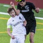 Glacier Peaks Ethan Bednarski and Jacksons Under Lizaso Lacabe both leap for a header during the game on Friday, April 28, 2023 in Snohomish, Washington. (Olivia Vanni / The Herald)