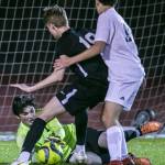 Jackson goalie Ben Ferguson blocks a shot during the game against Glacier Peak on Friday, April 28, 2023 in Snohomish, Washington. (Olivia Vanni / The Herald)