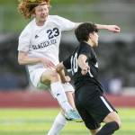 Glaicer Peaks Kollin Undseth beats Jacksons Archilea Dhima to the ball for a header during the game on Friday, April 28, 2023 in Snohomish, Washington. (Olivia Vanni / The Herald)