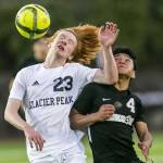 Glaicer Peaks Kollin Undseth jumps up for a header against Jacksons Anthony Gonzalez-Marroguin during the game on Friday, April 28, 2023 in Snohomish, Washington. (Olivia Vanni / The Herald)