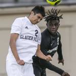 Glacier Peaks Gael Guerrero and Jacksons Jaden Ogunda both jump for a header during the game on Friday, April 28, 2023 in Snohomish, Washington. (Olivia Vanni / The Herald)