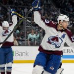Avalanche center Nathan MacKinnon (29) and left wing Artturi Lehkonen celebrate a goal by Erik Johnson against the Kraken during the second period of Game 6 of a first-round playoff series Friday in Seattle. (AP Photo/Lindsey Wasson)