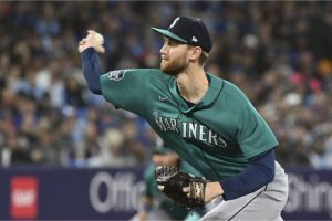 Seattle Mariners starting pitcher Easton McGee (59) throws to a Toronto Blue Jays batter during the first inning of a baseball game in Toronto, Saturday, April 29, 2023. (Jon Blacker/The Canadian Press via AP)