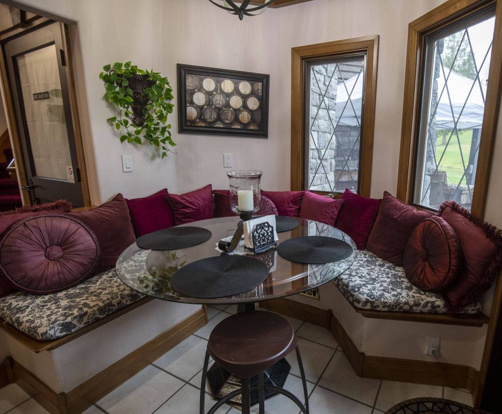 A dining area in the kitchen at High Rock Castle in Monroe. (Annie Barker / The Herald)