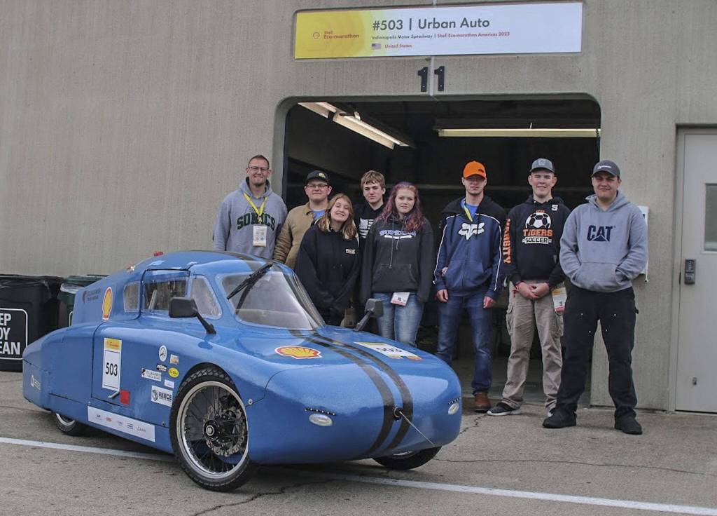 The Granite Falls Eco-Car team with their urban concept diesel car at the Shell Eco-Marathon at the Indianapolis Motor Speedway in April. (Photo courtesy of the Granite Falls High School)